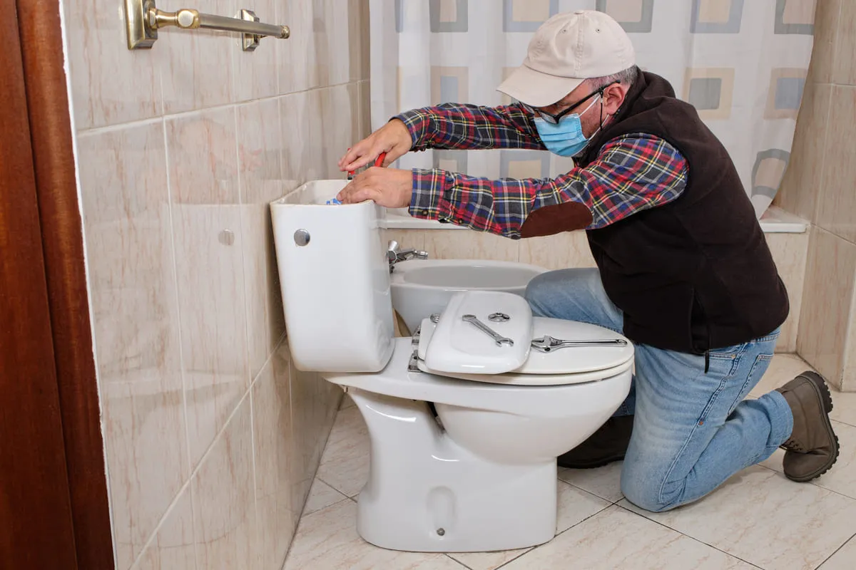 plumber-fixing-toilet